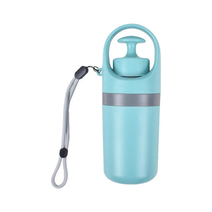 Portable dog poop scooper in teal plastic with top handle and wrist strap