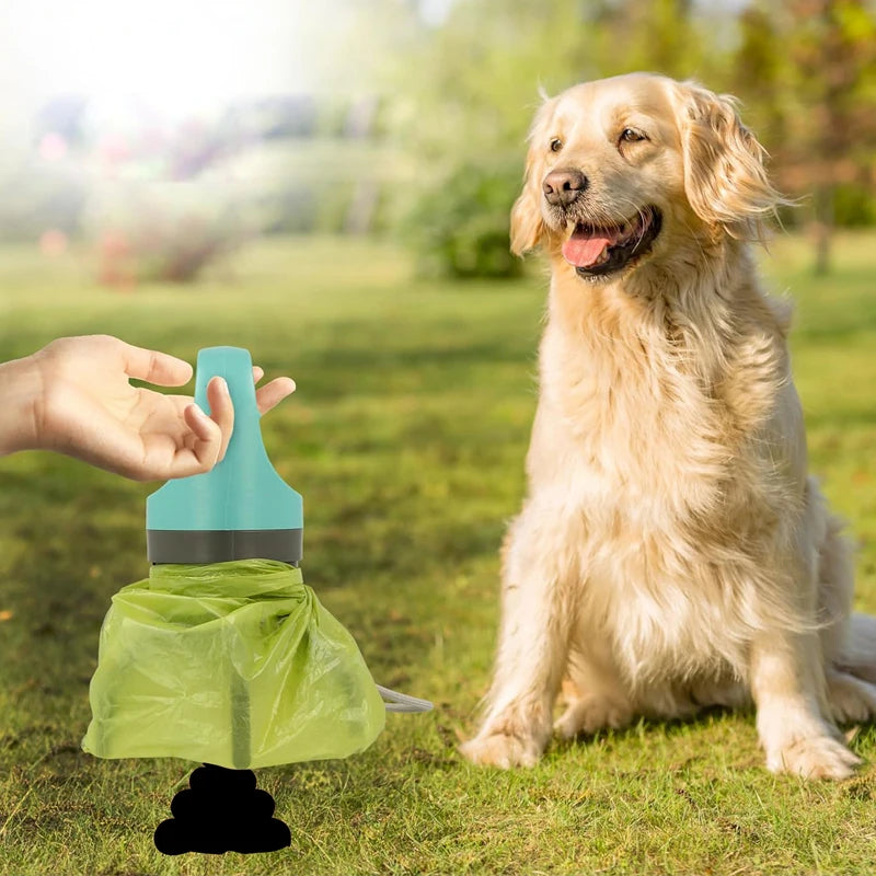 Portable dog poop scooper with teal handle and green bag, pictured beside a Golden Retriever on a sunny park lawn during a daily walk.