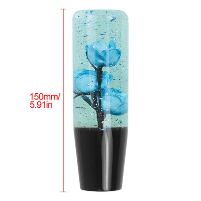 Universal Resin Shift Knob with blue flower in clear resin on black base, 150mm tall.