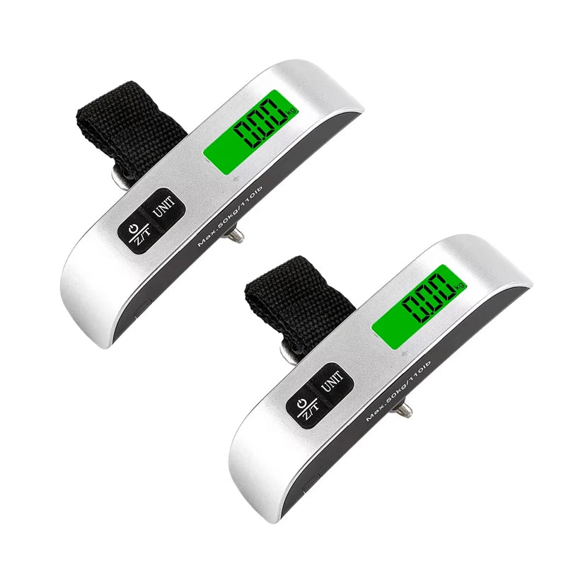 Portable digital scales, two silver units with green LCD displays and black straps